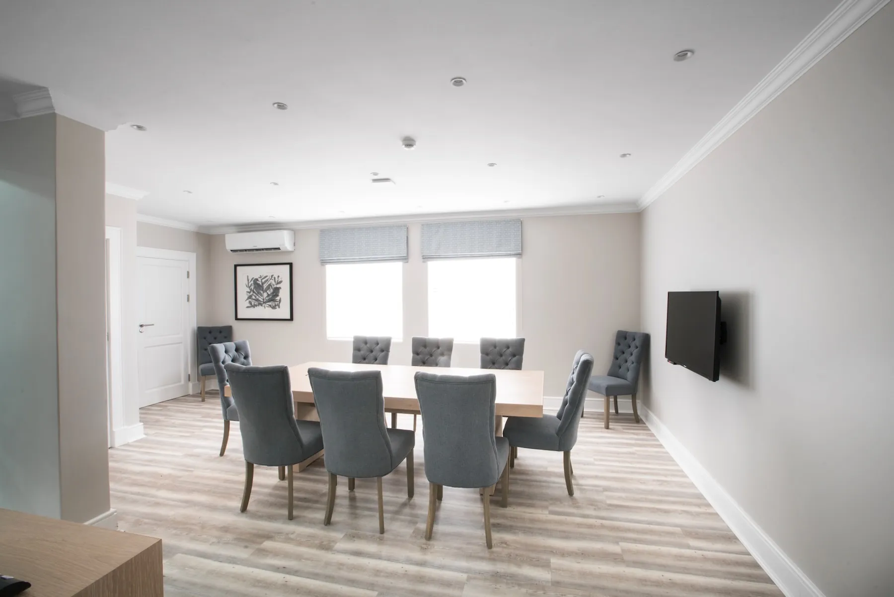 Conference room — spacious meeting room with wall-mounted screen and air conditioning | Studio Stay on Sixty6 boutique hotel & accommodation in Sandton